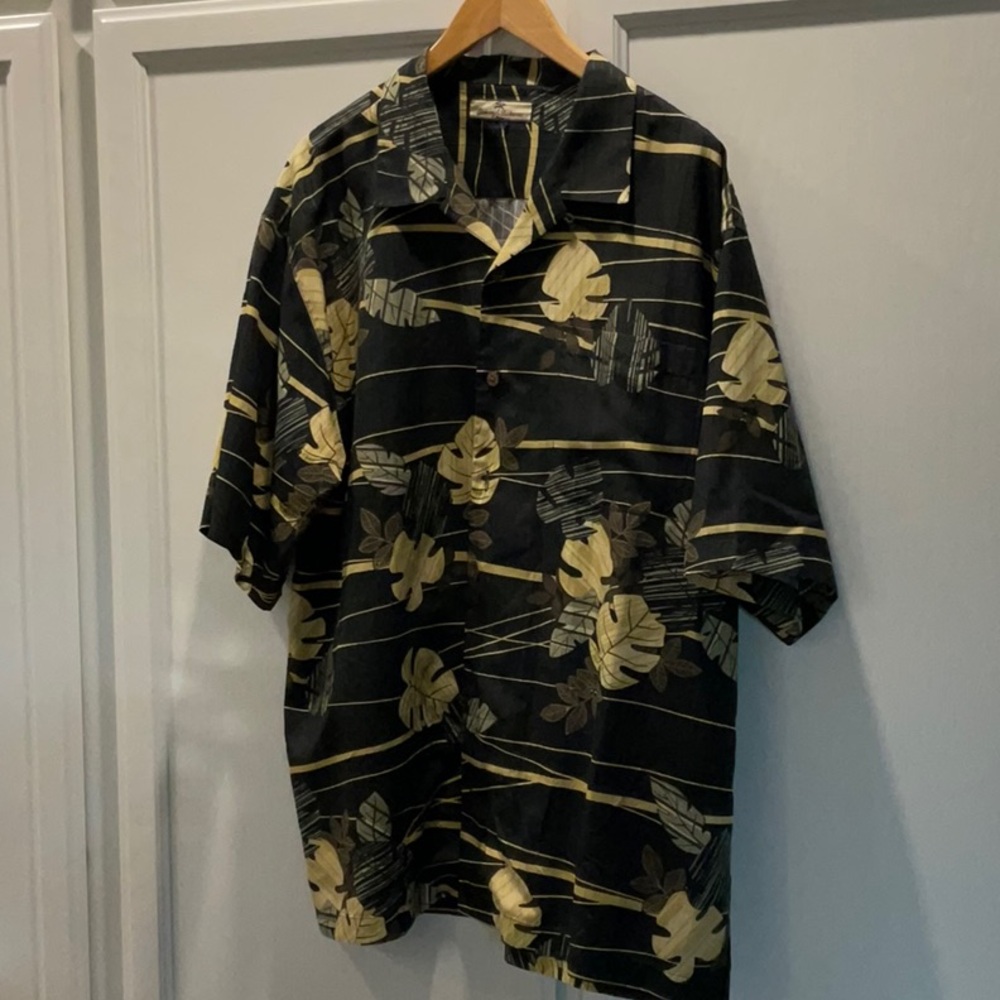 - Tommy Bahama silk camp shirt with leaves and palm trees.